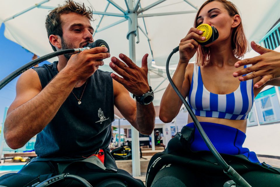 two divers checking the equipment on a private refresher dive